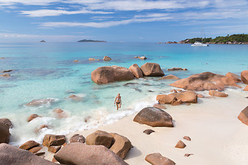 Image showing Woman enjoying Anse Lazio picture perfect beach on Praslin Island, Seychelles.