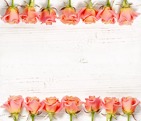 Image showing pink roses on white wood background