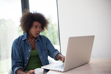 Image showing African American woman in the living room