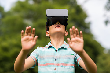 Image showing boy with virtual reality headset outdoors