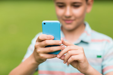 Image showing boy with smartphone outdoors at summer