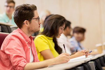 Image showing group of students with notebooks in lecture hall