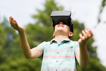 Image showing boy with virtual reality headset outdoors