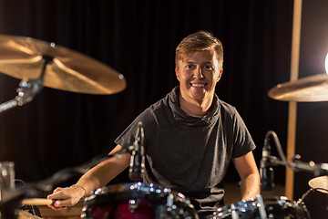 Image showing male musician playing drums and cymbals at concert