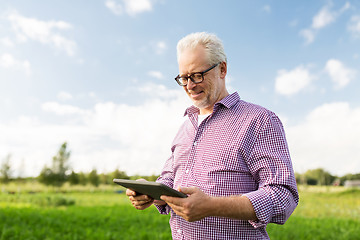 Image showing senior man with tablet pc computer at county