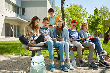 Image showing group of students with notebooks at school yard