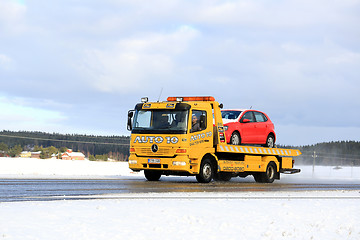 Image showing Yellow Tow Truck Carries Breakdown Car