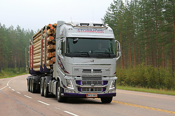 Image showing Silver Volvo FH Logging Truck on Foggy Morning