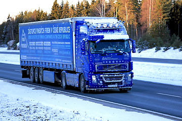 Image showing Blue Volvo FH12 460 Semi Truck Trucking in Snow and Ice 