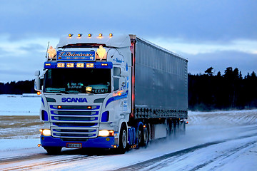 Image showing Super Scania Semi on Snowy Road at Sunset