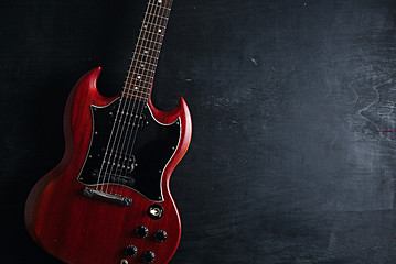 Image showing Electric guitar on wooden background