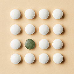 Image showing white and green pills