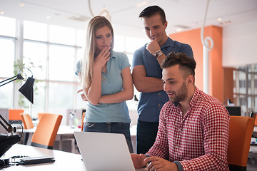 Image showing Group of young people employee workers with computer