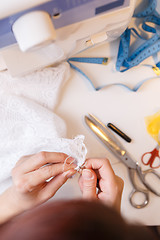 Image showing Young woman engaged in handicrafts