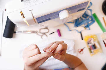 Image showing Girls with various sewing accessories