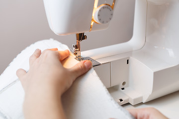 Image showing Photo of woman with sewing-machine