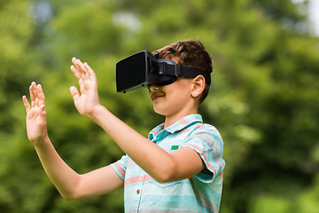 Image showing boy with virtual reality headset outdoors