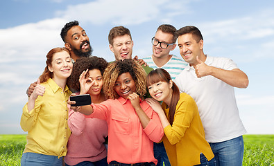 Image showing group of people taking selfie by smartphone