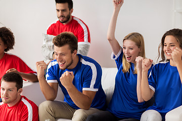 Image showing friends or football fans watching soccer at home