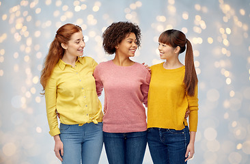 Image showing international group of happy women over lights