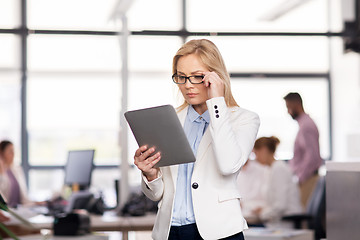 Image showing businesswoman with tablet pc at office