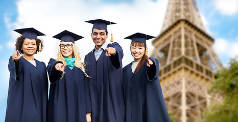 Image showing happy bachelors pointing at you over eiffel tower