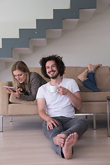 Image showing couple relaxing at  home with tablet computers