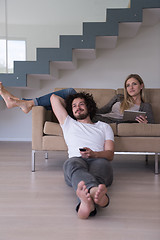 Image showing young couple relaxes in the living room