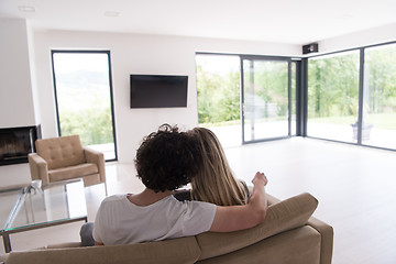 Image showing Rear view of couple watching television