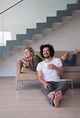 Image showing couple relaxing at  home with tablet computers