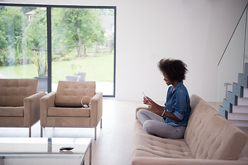 Image showing african american woman at home with digital tablet