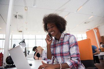 Image showing African American informal business woman working in the office