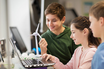 Image showing children with laptop and wind turbine at school