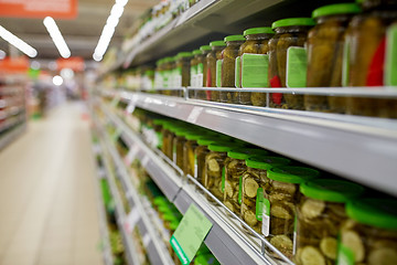 Image showing jars of pickles on grocery or supermarket shelves