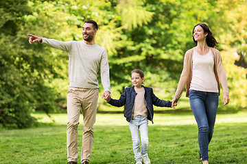 Image showing happy family walking in summer park