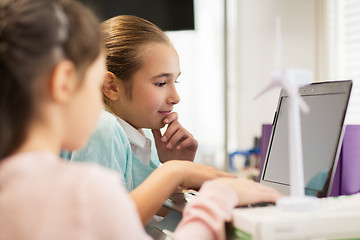 Image showing children with laptop and wind turbine at school