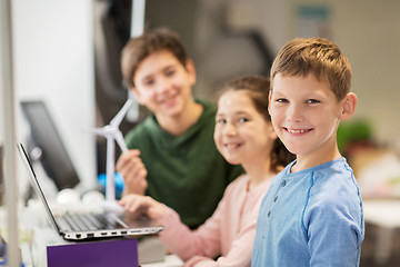 Image showing children with laptop and wind turbine at school