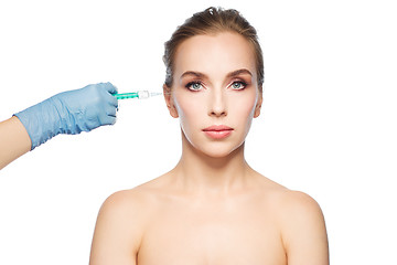 Image showing woman face and hand with syringe making injection