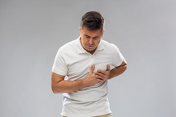 Image showing unhappy man suffering from heart ache