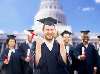 Image showing happy student with diploma celebrating graduation