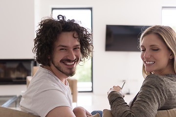 Image showing Rear view of couple watching television