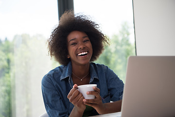 Image showing African American woman in the living room