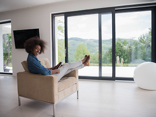 Image showing african american woman at home with digital tablet