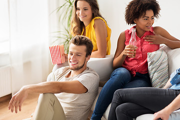 Image showing friends with beer talking and watching tv at home