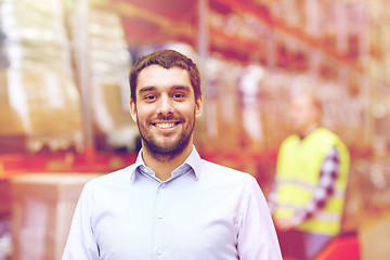 Image showing businessman over warehouse loader on forklift 