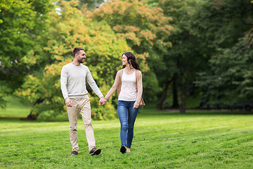 Image showing happy couple walking in summer park