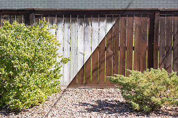 Image showing Fence Before and After Solid Paint Stain Application