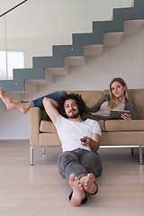 Image showing young couple relaxes in the living room