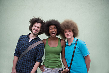 Image showing multiethnic group of happy three friends