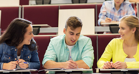 Image showing group of students with notebooks in lecture hall